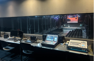 São Paulo training facility control room with digital mixing consoles, displays, and audio equipment racks.