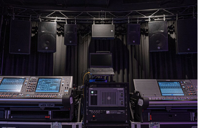 Bangkok training facility with digital mixing consoles and loudspeaker demonstration setup.