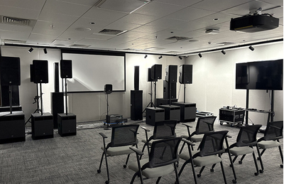 Bengaluru training facility room with presentation display, seating, and audio equipment.